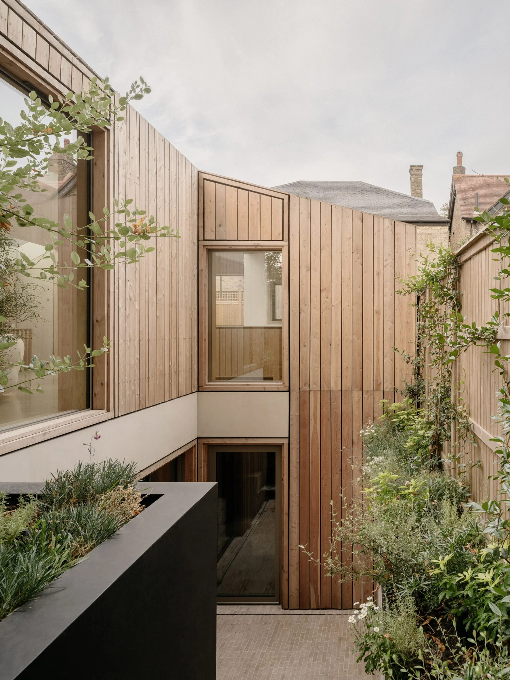 Timber-clad facade overlooking a planted lightwell