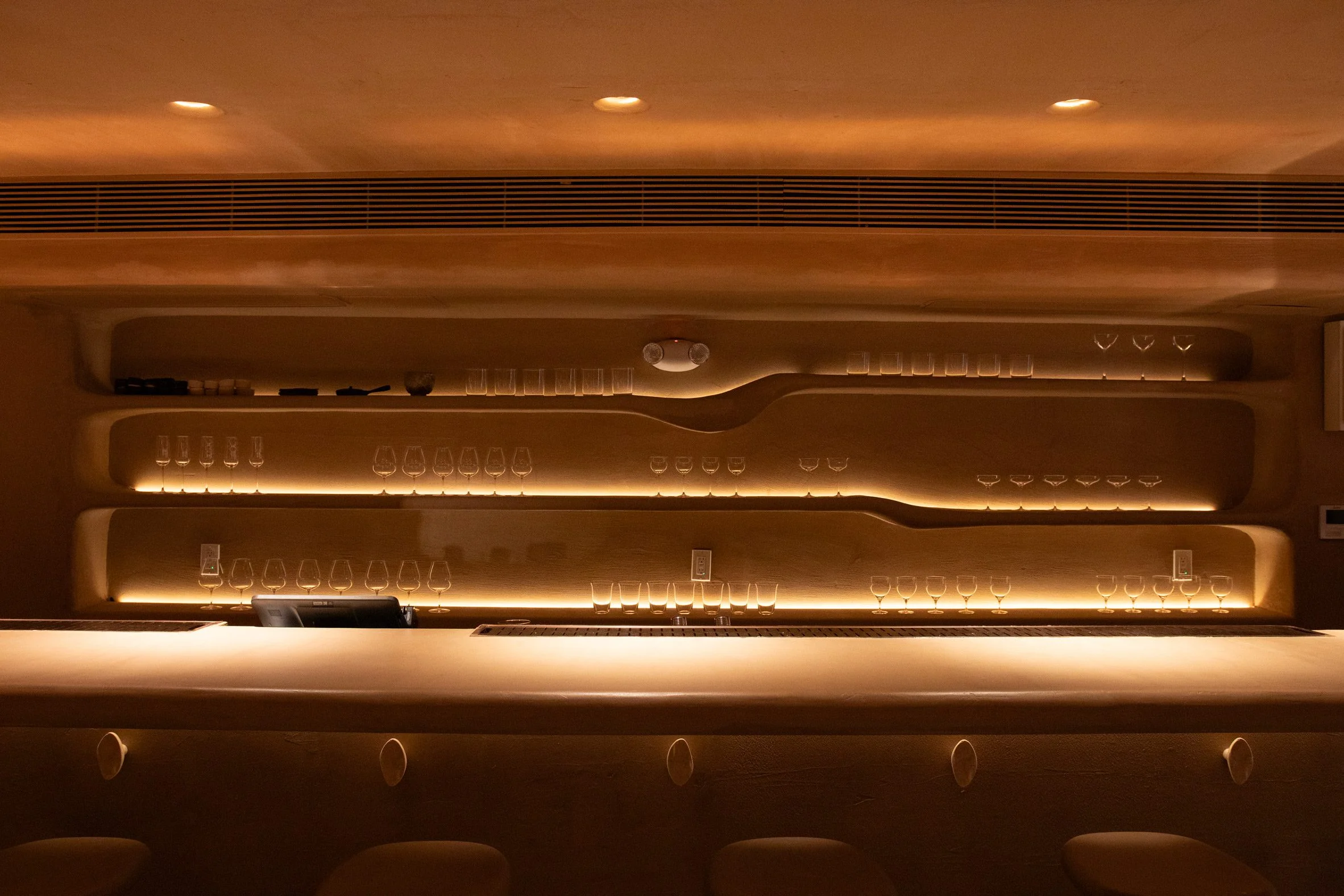 Sculpted bar shelves without straight lines